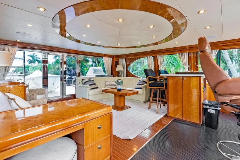 Slide: The Image of Luxurious 1999 Monte Fino 82 yacht interior with elegant wood finishes and spacious seating. - 18