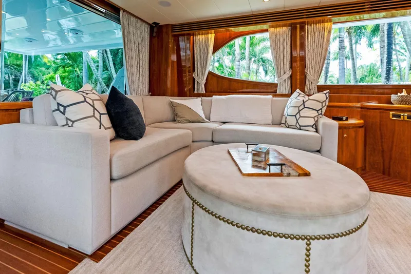 Slide: The Image of Luxurious Monte Fino 82 yacht interior with elegant seating, wooden accents, and large windows, 1999 model. - 23