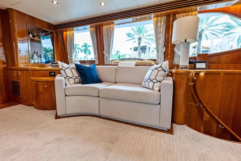 Slide: The Image of Luxurious Monte Fino 82 yacht interior with elegant sofa and wooden accents, 1999 model. - 24