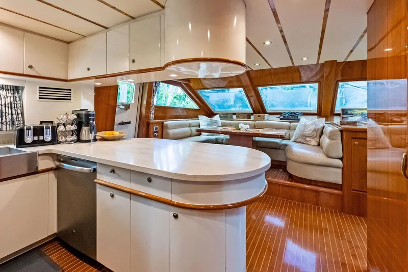 Slide: The Image of Luxurious interior of 1999 Monte Fino 82 yacht with modern kitchen and spacious seating area. - 33