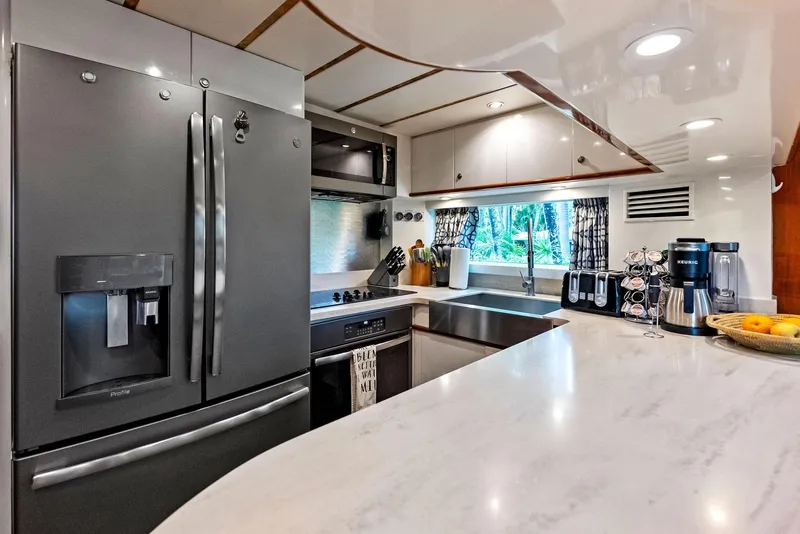 Slide: The Image of Modern kitchen in 1999 Monte Fino 82 yacht with stainless steel appliances and sleek countertops. - 34
