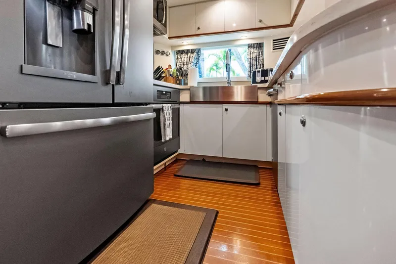 Slide: The Image of Modern kitchen interior on 1999 Monte Fino 82 yacht with stainless steel appliances. - 36