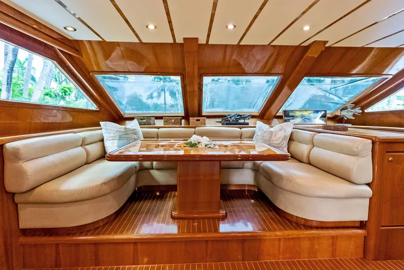 Slide: The Image of Luxurious interior of 1999 Monte Fino 82 yacht with elegant seating and wooden finishes. - 38