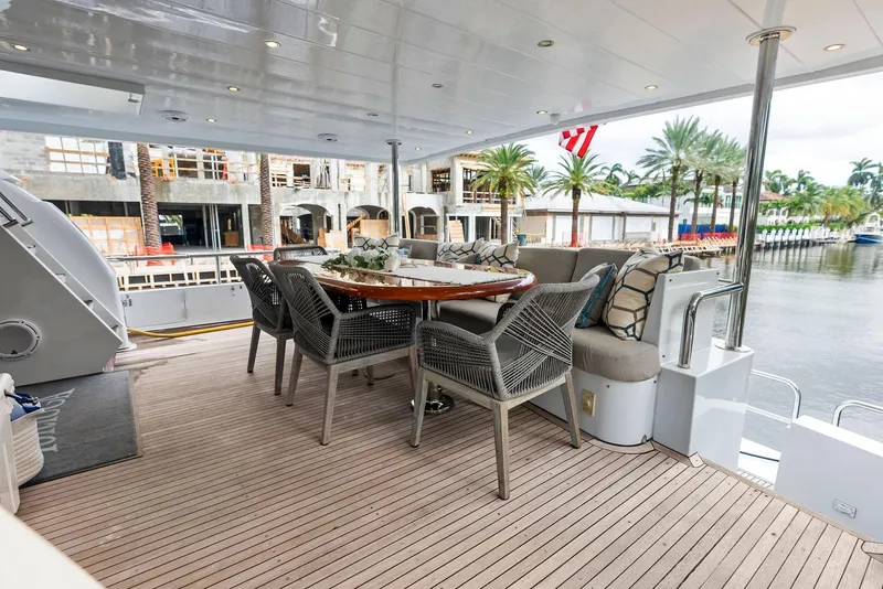 Slide: The Image of Spacious deck of 1999 Monte Fino 82 yacht with elegant outdoor seating. - 4