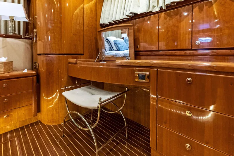 Slide: The Image of Luxurious wooden interior of 1999 Monte Fino 82 yacht with vanity and seating. - 47