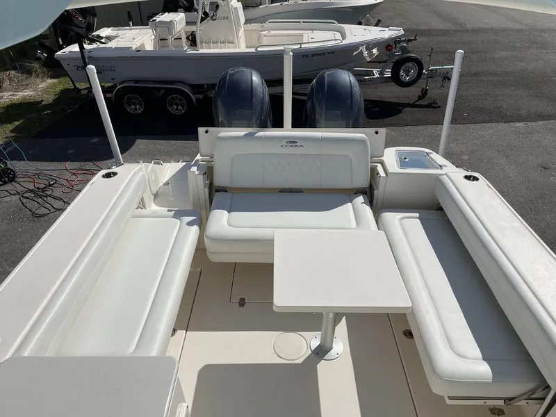 Slide: The Image of 2022 Cobia 280 DC boat interior with seating and table. - 3
