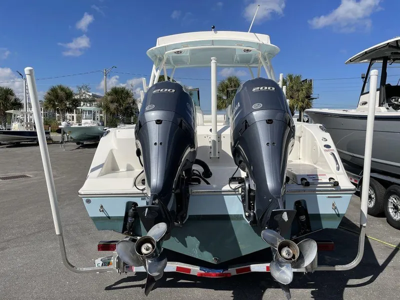 Slide: The Image of 2022 Cobia 280 DC boat with twin Yamaha 200 engines, rear view. - 4