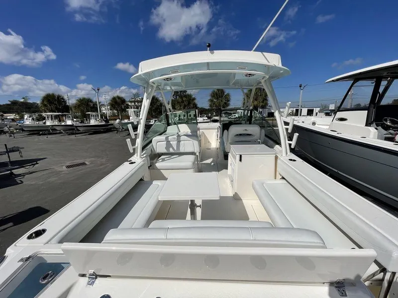 Slide: The Image of 2022 Cobia 280 DC boat with spacious seating and modern design. - 5
