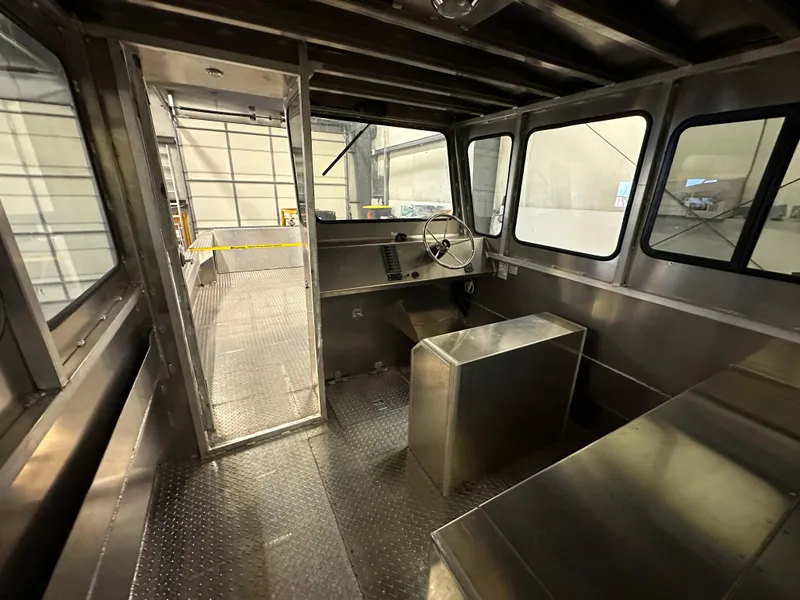 Slide: The Image of Interior of 2024 Bayview Boats 26 Landing Craft, showcasing helm and seating area. - 14