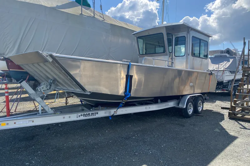 Slide: The Image of 2026 Bayview Boats 26 Landing Craft on trailer under sunny sky. - 25