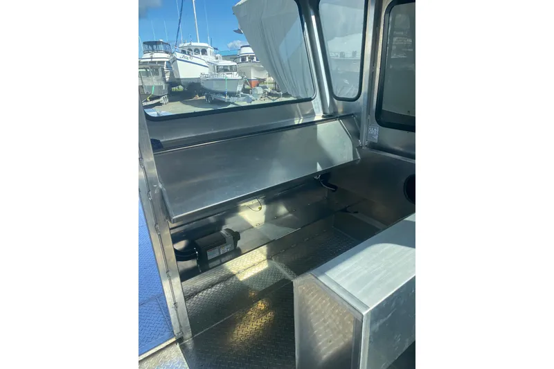 Slide: The Image of Interior of 2026 Bayview Boats 26 Landing Craft, showcasing metal seating and windows. - 28