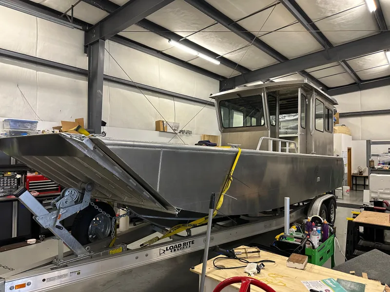 Slide: The Image of 2024 Bayview Boats 26 Landing Craft in a workshop on a trailer. - 8