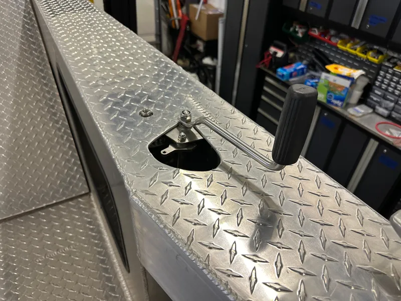 Slide: The Image of Bayview Boats 2024 26 Landing Craft with diamond plate deck and control lever. - 13