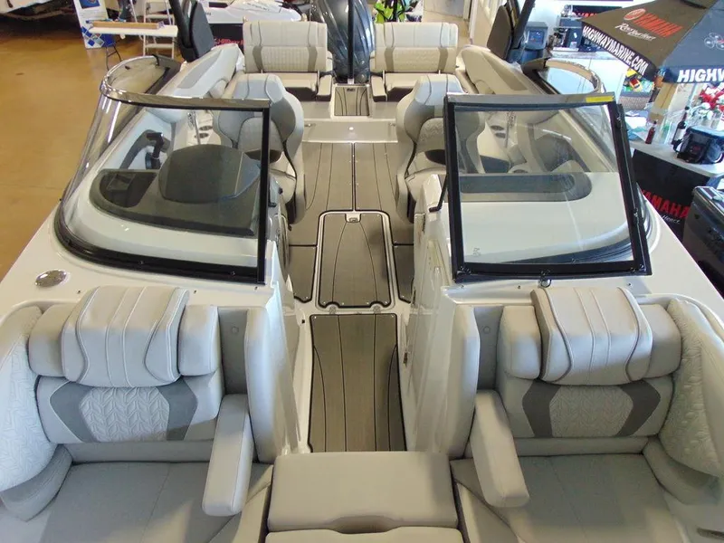 Slide: The Image of 2024 Hurricane SunDeck 2600 OB boat interior with spacious seating and modern design. - 12