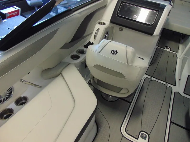 Slide: The Image of 2024 Hurricane SunDeck 2600 OB boat interior with white seating and modern dashboard. - 13