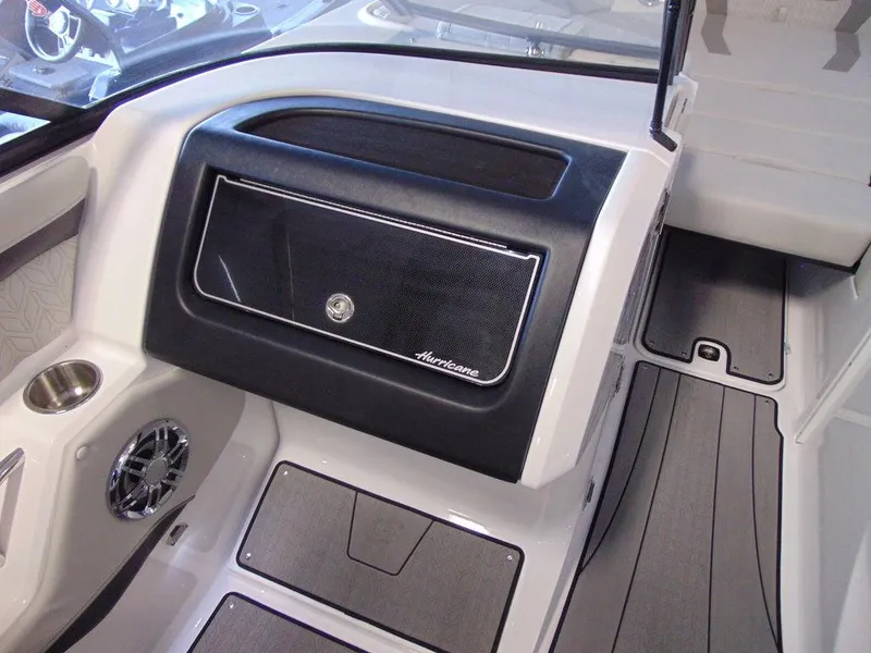 Slide: The Image of 2024 Hurricane SunDeck 2600 OB boat interior, featuring a sleek dashboard and storage compartment. - 14