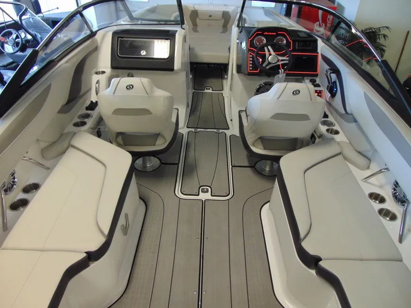 Slide: The Image of 2024 Hurricane SunDeck 2600 OB boat interior with modern seating and dashboard. - 15