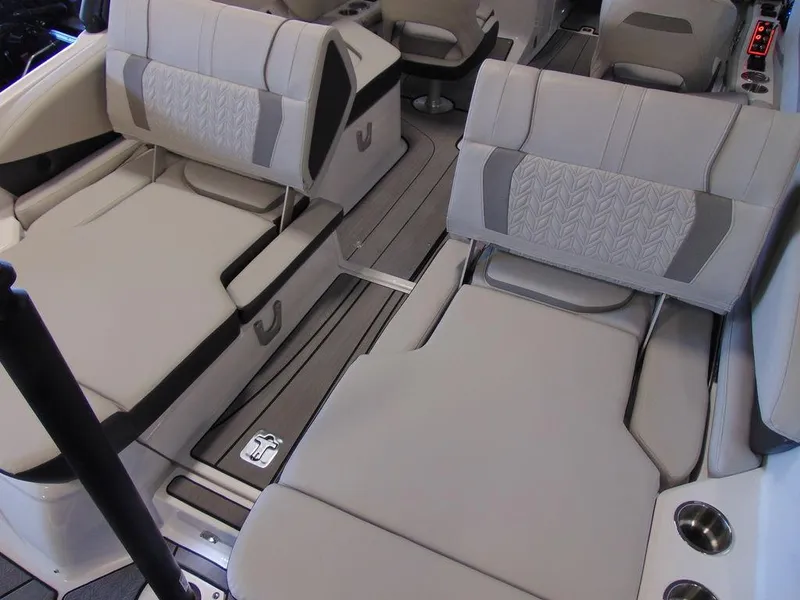 Slide: The Image of 2024 Hurricane SunDeck 2600 OB interior seating with adjustable lounge chairs. - 7