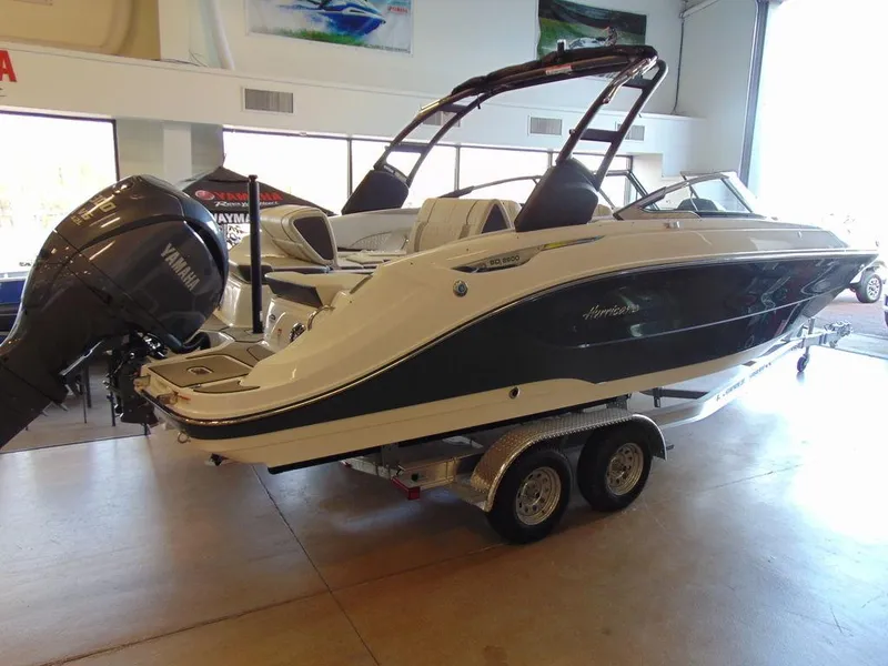 Slide: The Image of 2024 Hurricane SunDeck 2600 OB boat on a trailer in a showroom. - 9