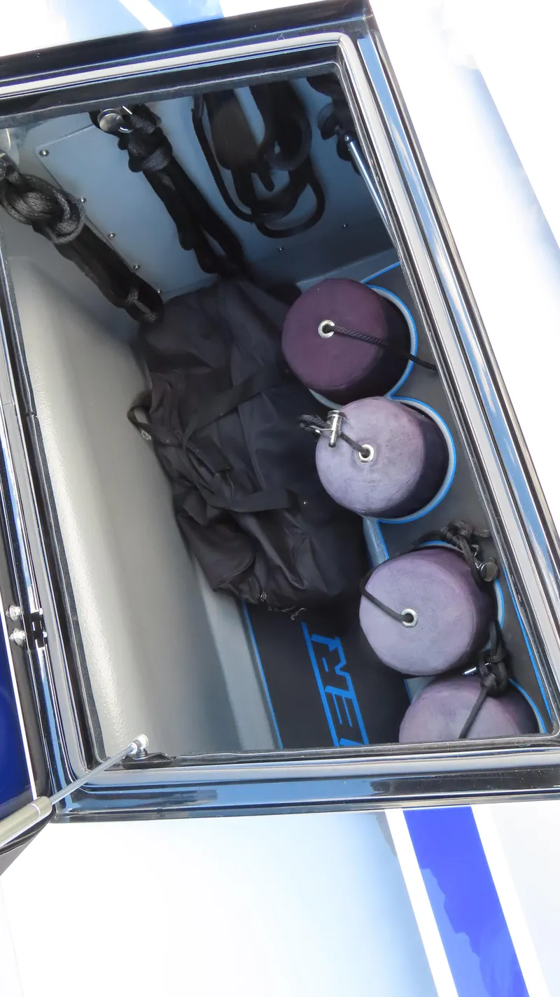 Slide: The Image of Storage compartment of a 2020 Outerlimits 46SC boat with fenders and gear. - 13