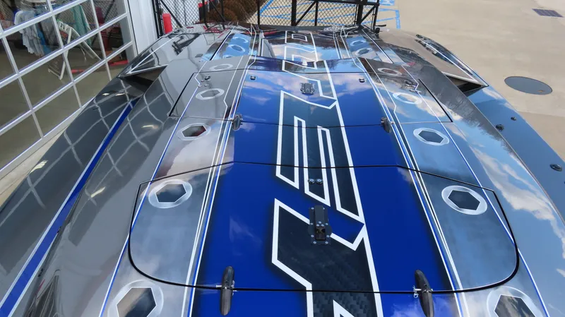 Slide: The Image of 2020 Outerlimits 46SC powerboat with sleek blue and silver design. - 14