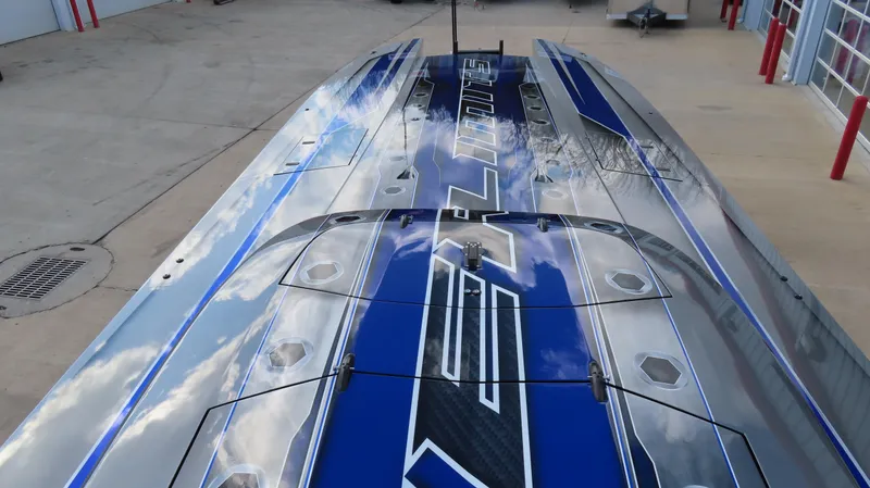 Slide: The Image of 2020 Outerlimits 46SC powerboat with sleek blue and silver design. - 15