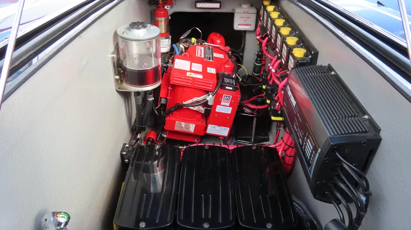 Slide: The Image of Engine compartment of a 2020 Outerlimits 46SC boat with batteries and wiring. - 17