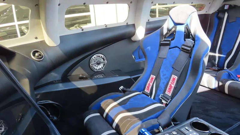 Slide: The Image of 2020 Outerlimits 46SC interior with blue racing seats and harnesses. - 23