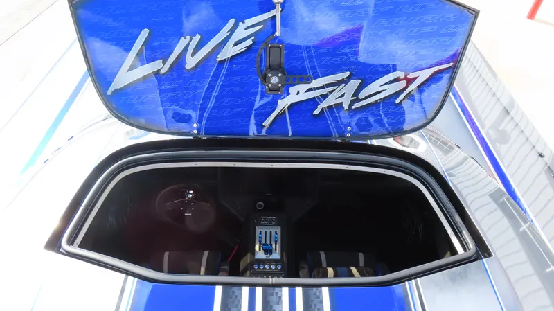 Slide: The Image of 2020 Outerlimits 46SC boat with Live Fast decal on open hatch. - 25