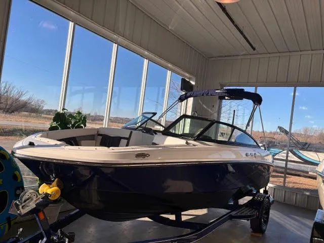 The Image of 2024 Monterey M205 Family Bowrider boat on trailer in showroom. - 0