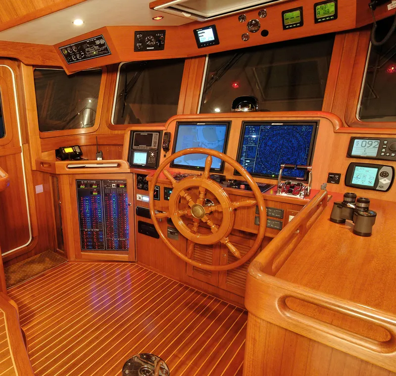 Slide: The Image of Wooden helm of 2026 Selene 54 Classic Explorer with navigation instruments and controls. - 10