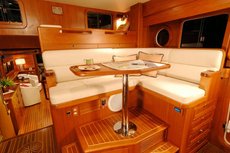 Slide: The Image of Luxurious interior of 2026 Selene 54 Classic Explorer yacht with elegant wood finish and cozy seating. - 9