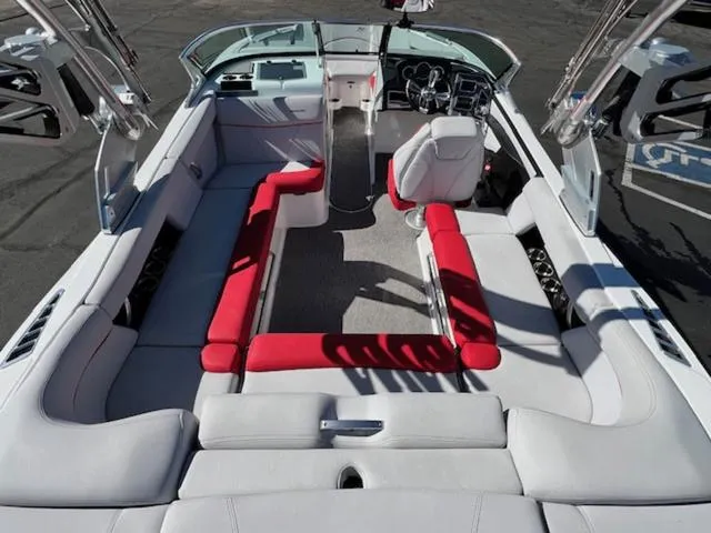 Slide: The Image of 2018 MasterCraft XT22 boat interior with red and white seating. - 10