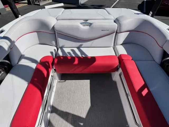 Slide: The Image of 2018 MasterCraft XT22 boat interior with white and red seating. - 14