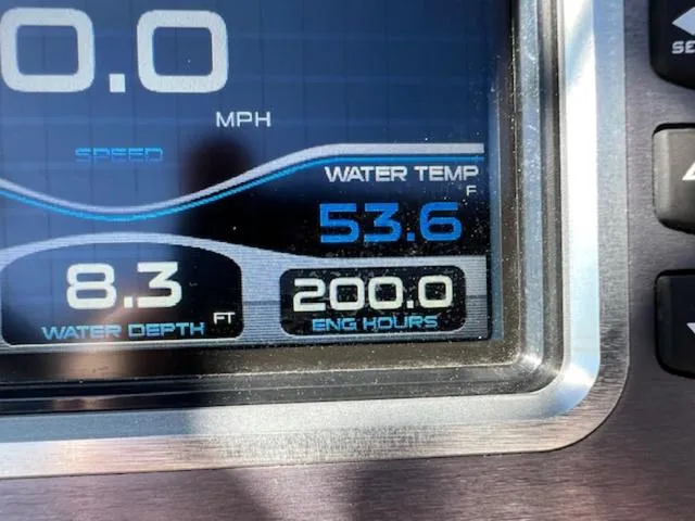 Slide: The Image of 2018 MasterCraft XT22 dashboard display showing water temperature, depth, and engine hours. - 20