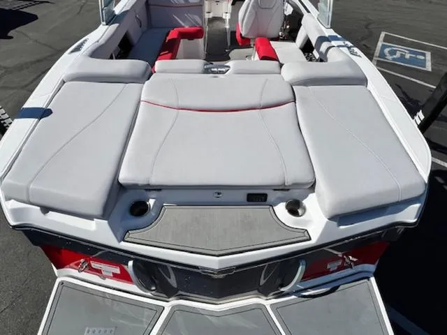 Slide: The Image of 2018 MasterCraft XT22 boat with spacious seating and modern design. - 9