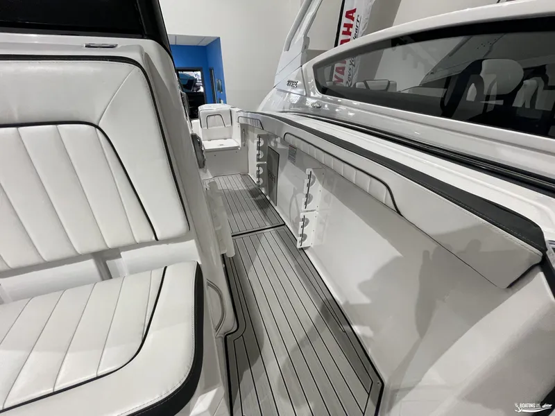 Slide: The Image of 2024 Yamaha Boats 255 FSH Sport H interior with sleek seating and modern design. - 10