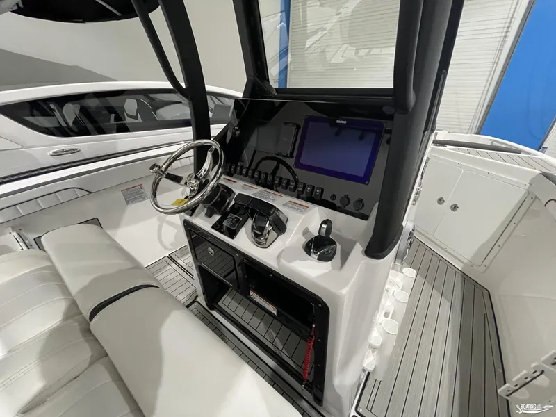 Slide: The Image of 2024 Yamaha Boats 255 FSH Sport H helm with modern controls and navigation display. - 15