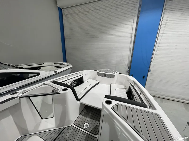 Slide: The Image of 2024 Yamaha Boats 255 FSH Sport H interior with sleek seating and modern design. - 4