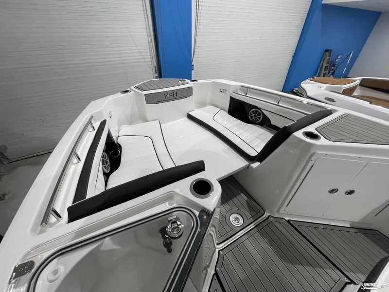 Slide: The Image of 2024 Yamaha Boats 255 FSH Sport H interior with sleek seating and modern design. - 5