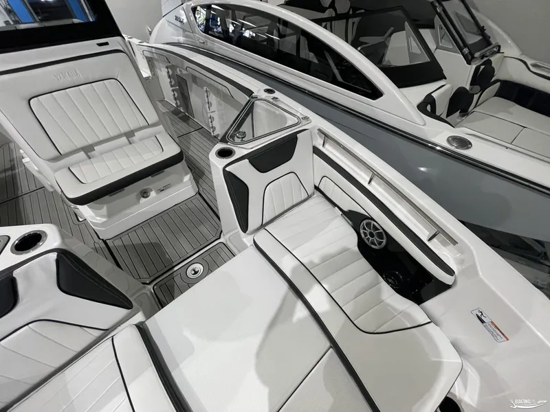 Slide: The Image of 2024 Yamaha Boats 255 FSH Sport H interior with sleek seating and modern design. - 7