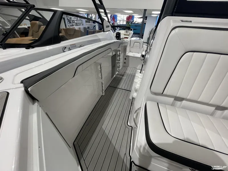 Slide: The Image of 2024 Yamaha Boats 255 FSH Sport H interior with sleek seating and modern design. - 9