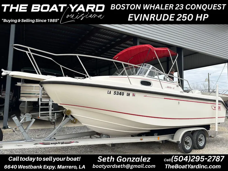 Slide: The Image of 1998 Boston Whaler 23 Conquest with Evinrude 250 HP on trailer at The Boat Yard. - 1