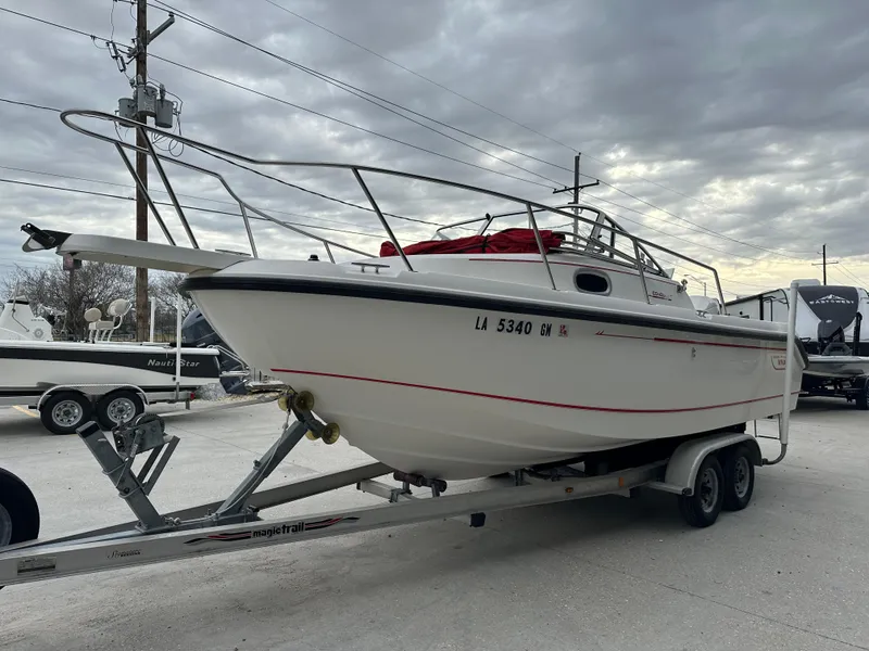 Slide: The Image of 1998 Boston Whaler 23 Conquest on trailer, ready for transport. - 21