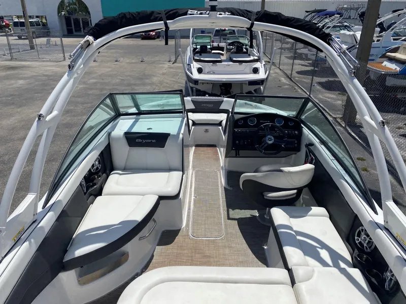 Slide: The Image of 2019 Bryant Speranza boat interior with white seating and modern dashboard. - 10