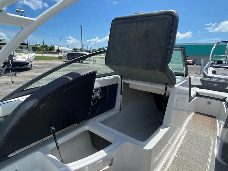 Slide: The Image of 2019 Bryant Speranza boat with open storage compartments on a sunny day. - 13