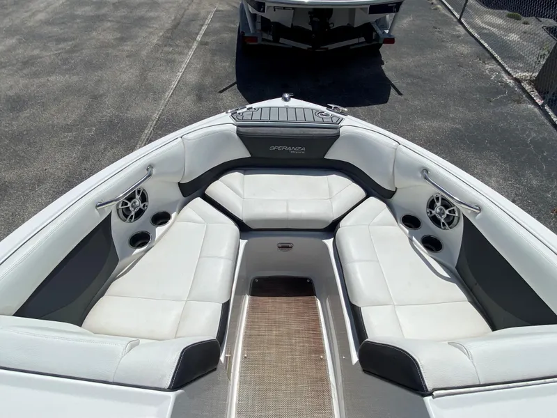 Slide: The Image of 2019 Bryant Speranza boat interior with white leather seating and built-in speakers. - 17