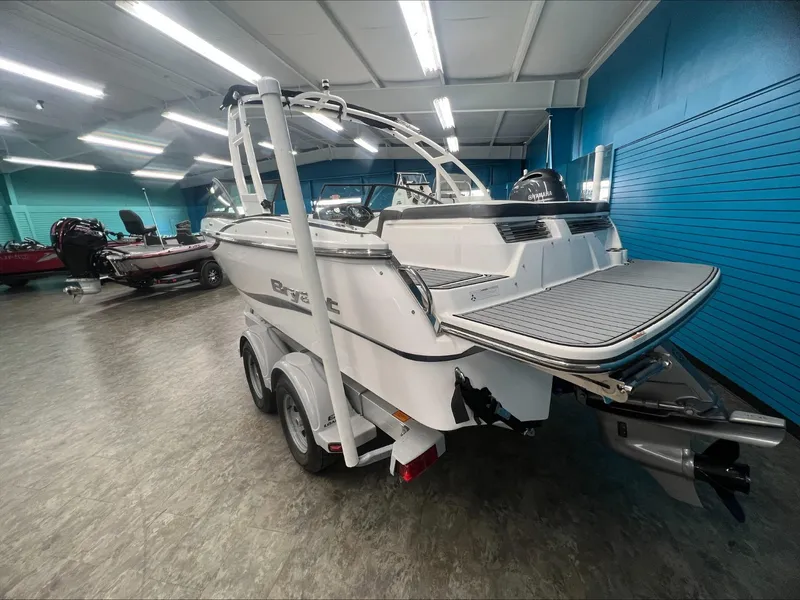 Slide: The Image of 2019 Bryant Speranza boat in showroom, rear view with trailer. - 4