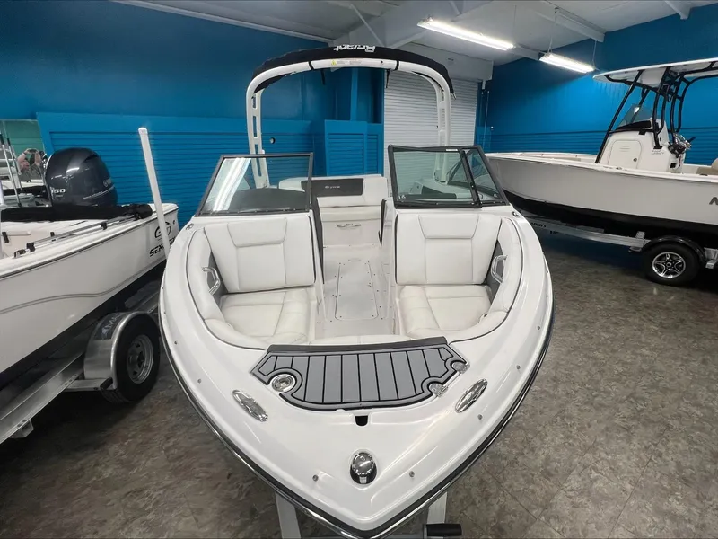 Slide: The Image of 2019 Bryant Speranza boat in showroom, white interior, sleek design. - 5