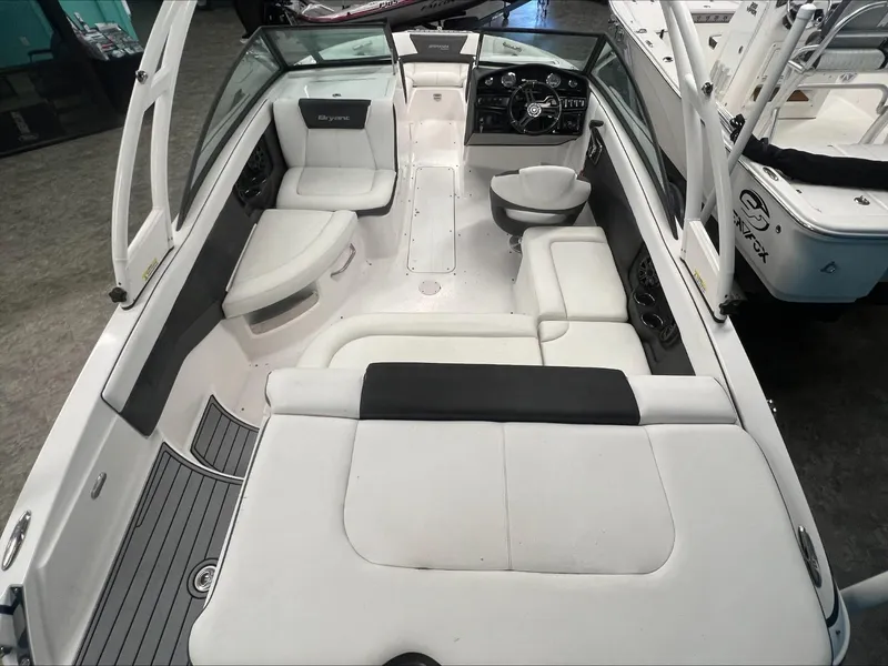 Slide: The Image of 2019 Bryant Speranza boat interior with white seating and modern dashboard. - 6